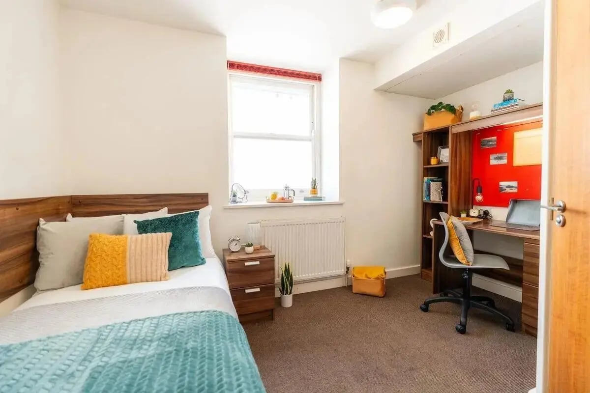 Bed desk shelves and chair bedroom at The Craft Building in London Student Accommodation