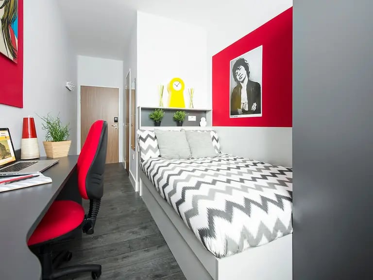 Desk chair bed with chevron bedding Bedroom at Yugo Arran House in Edinburgh Student Accommodation