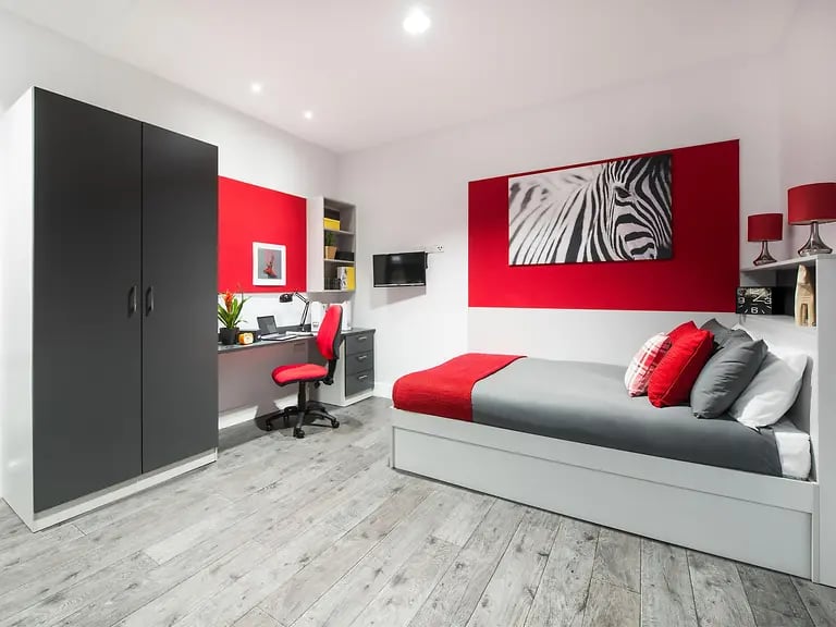 Wardrobe desk chair bed with zebra art bedroom at Yugo Arran House in Edinburgh Student Accommodation
