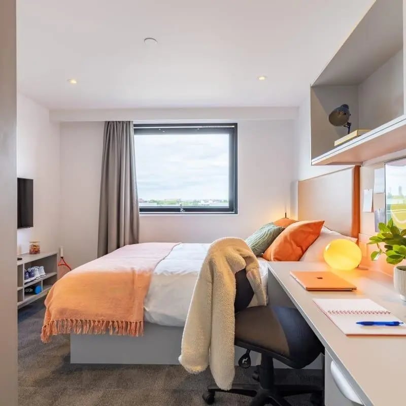 Bed desk chair and window bedroom at True Manchester-Salford in Salford Student Accommodation