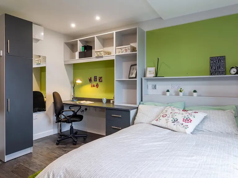 Wardrobe desk chair bed with pillows Bedroom at Yugo Austen House in Southampton Student Accommodation