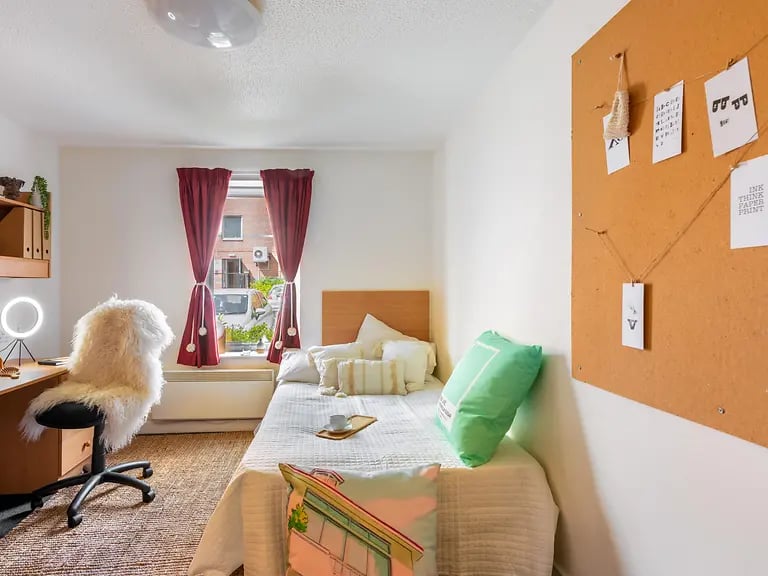 Bed desk chair mirror and corkboard bedroom at Yugo Bramall Court in Sheffield Student Accommodation