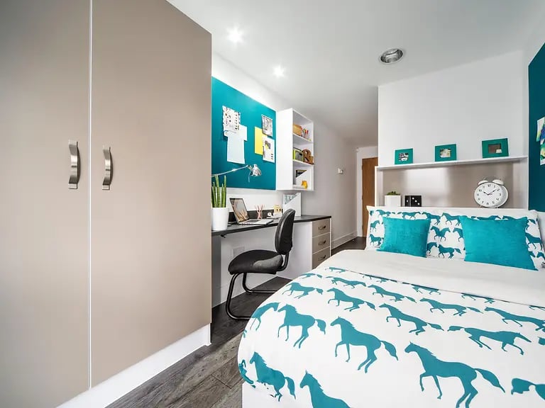 Wardrobe bed desk with laptop and chair bedroom at Yugo Canal Point in Edinburgh Student Accommodation