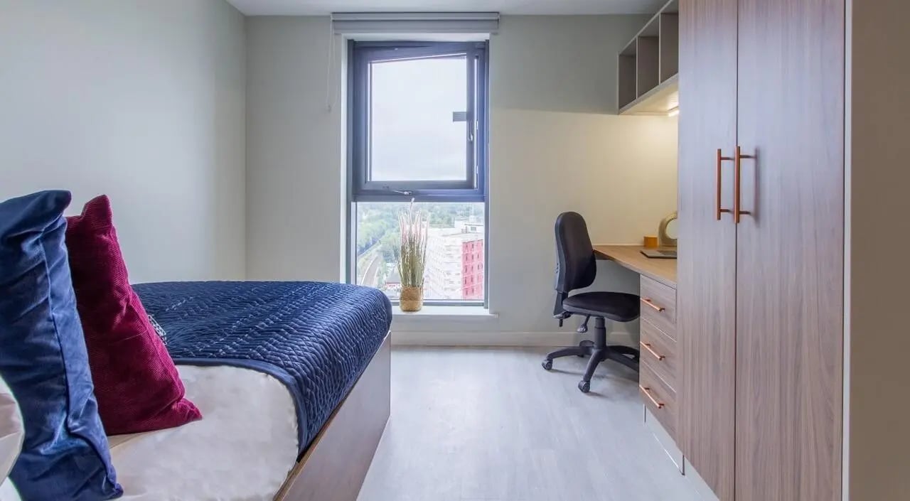 Bed desk chair and closet bedroom study area at The Toybox in Birmingham Student Accommodation