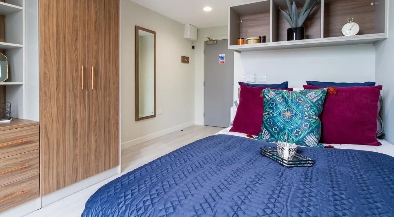 Closet mirror pillows on bed Bedroom at The Toybox in Birmingham Student Accommodation