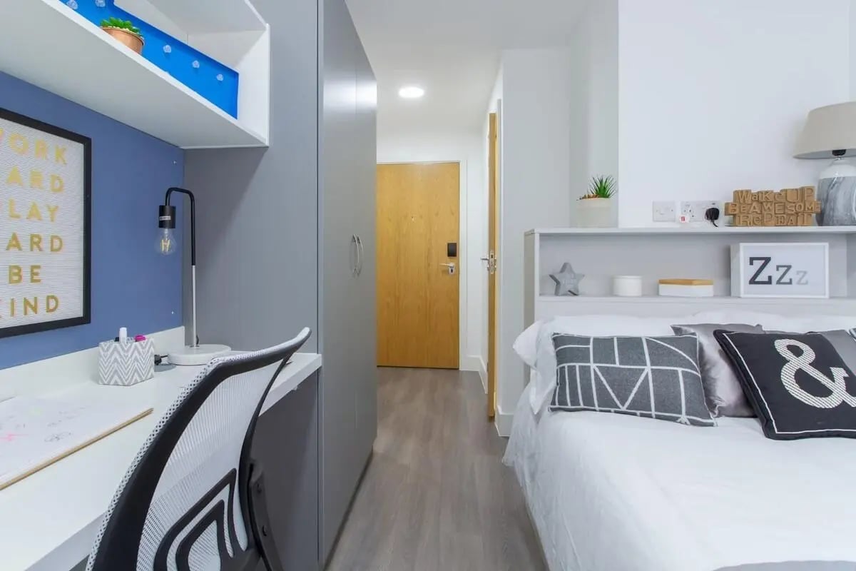Desk chair closet bed and door bedroom at Collegelands in Glasgow Student Accommodation