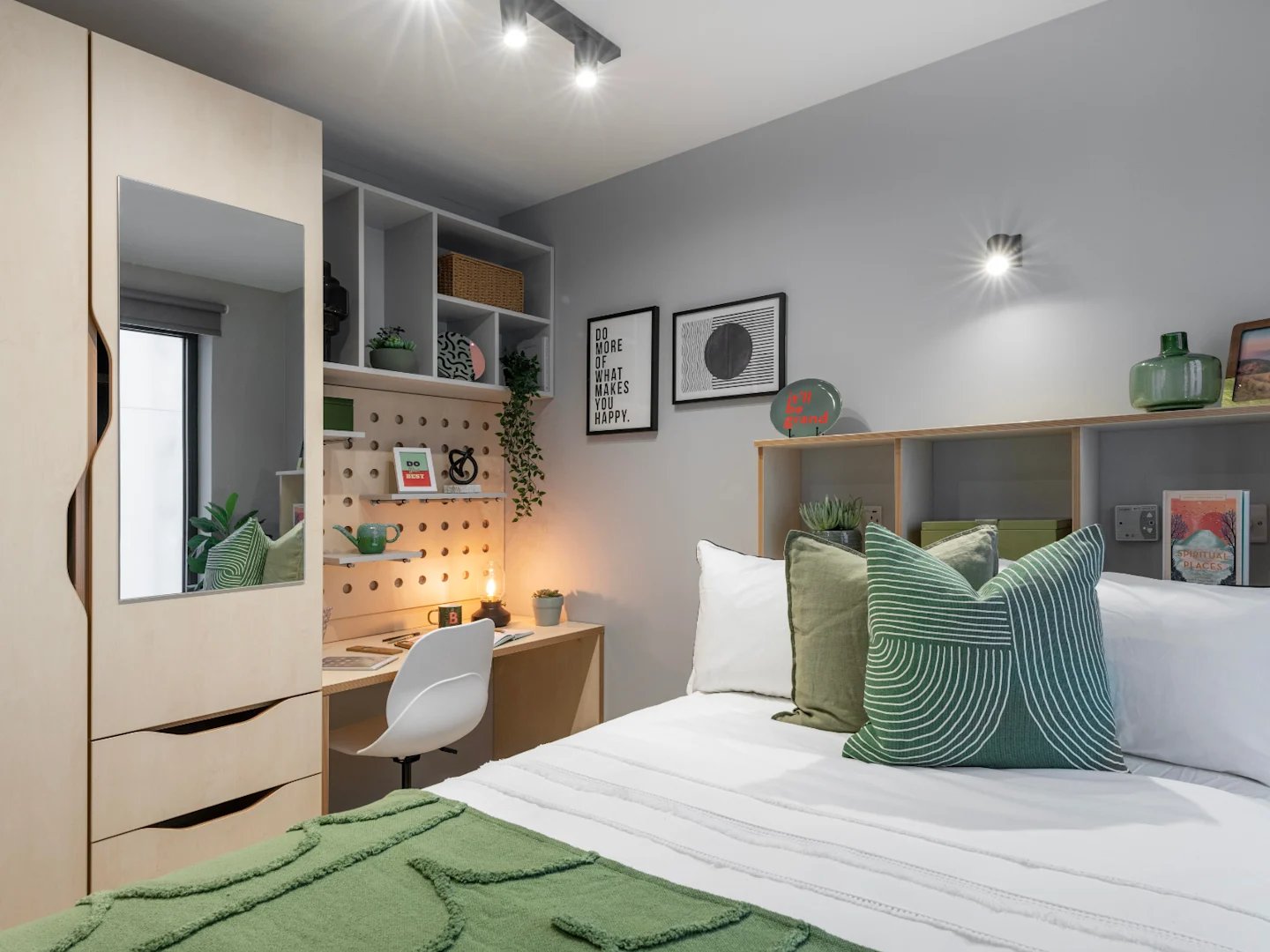 Wardrobe desk bed with green pillows bedroom at Alma Place in Belfast Student Accommodation