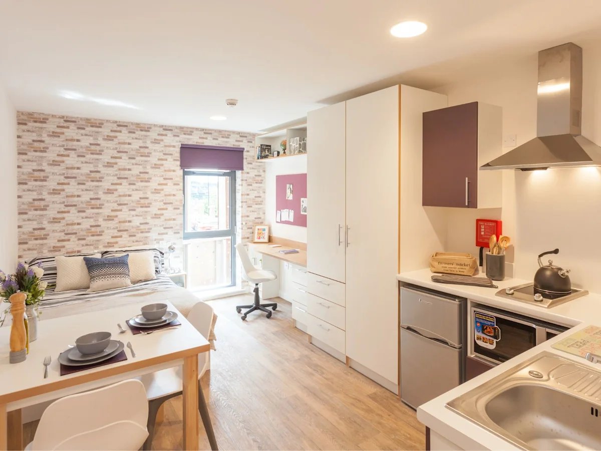 Bed table desk wardrobe kitchen living room at Roman House Newcastle in Newcastle Upon Tyne Student Accommodation