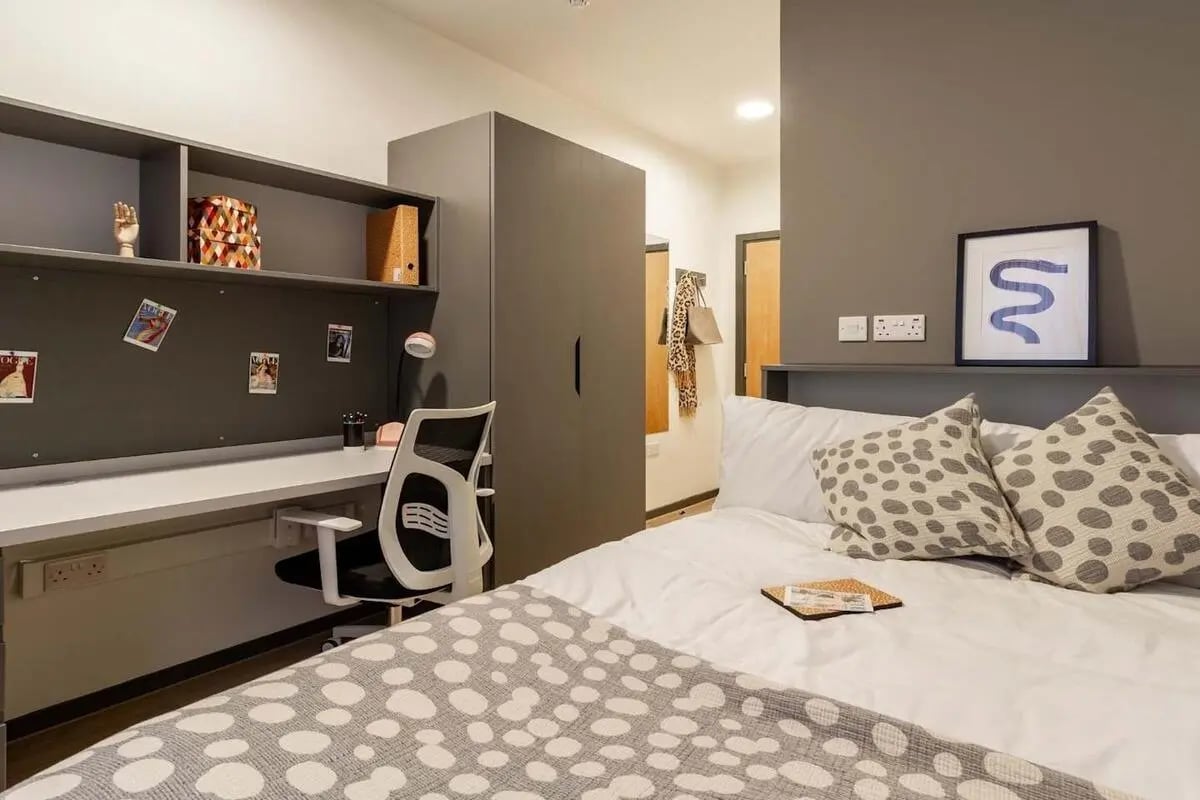 Desk chair shelves and bed student bedroom at The Tannery Leicester in Leicester Student Accommodation