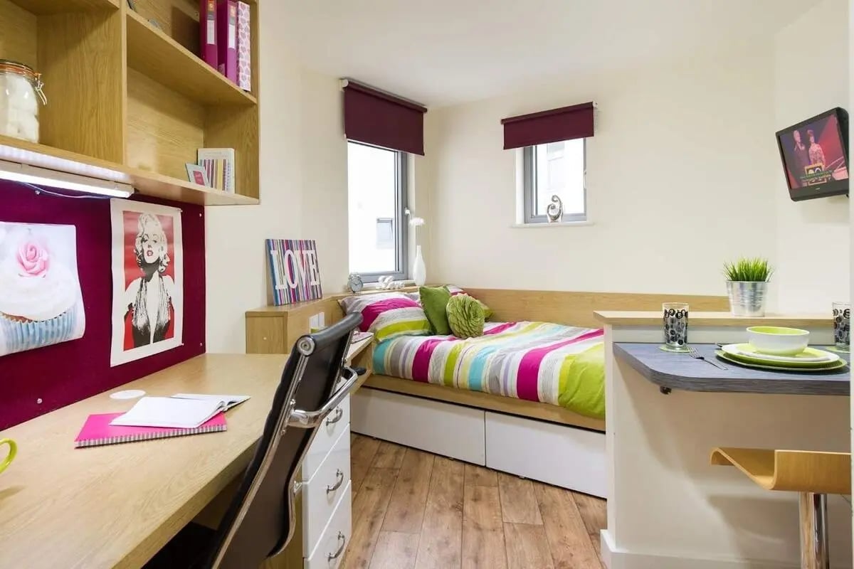 Desk bed shelves and counter student room interior at Optima in Loughborough Student Accommodation