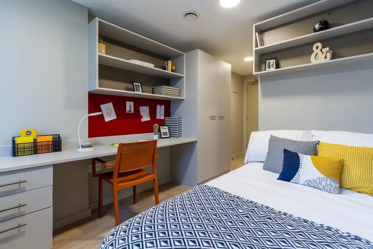 Desk bed shelves and wardrobe bedroom at Calico in Liverpool Student Accommodation