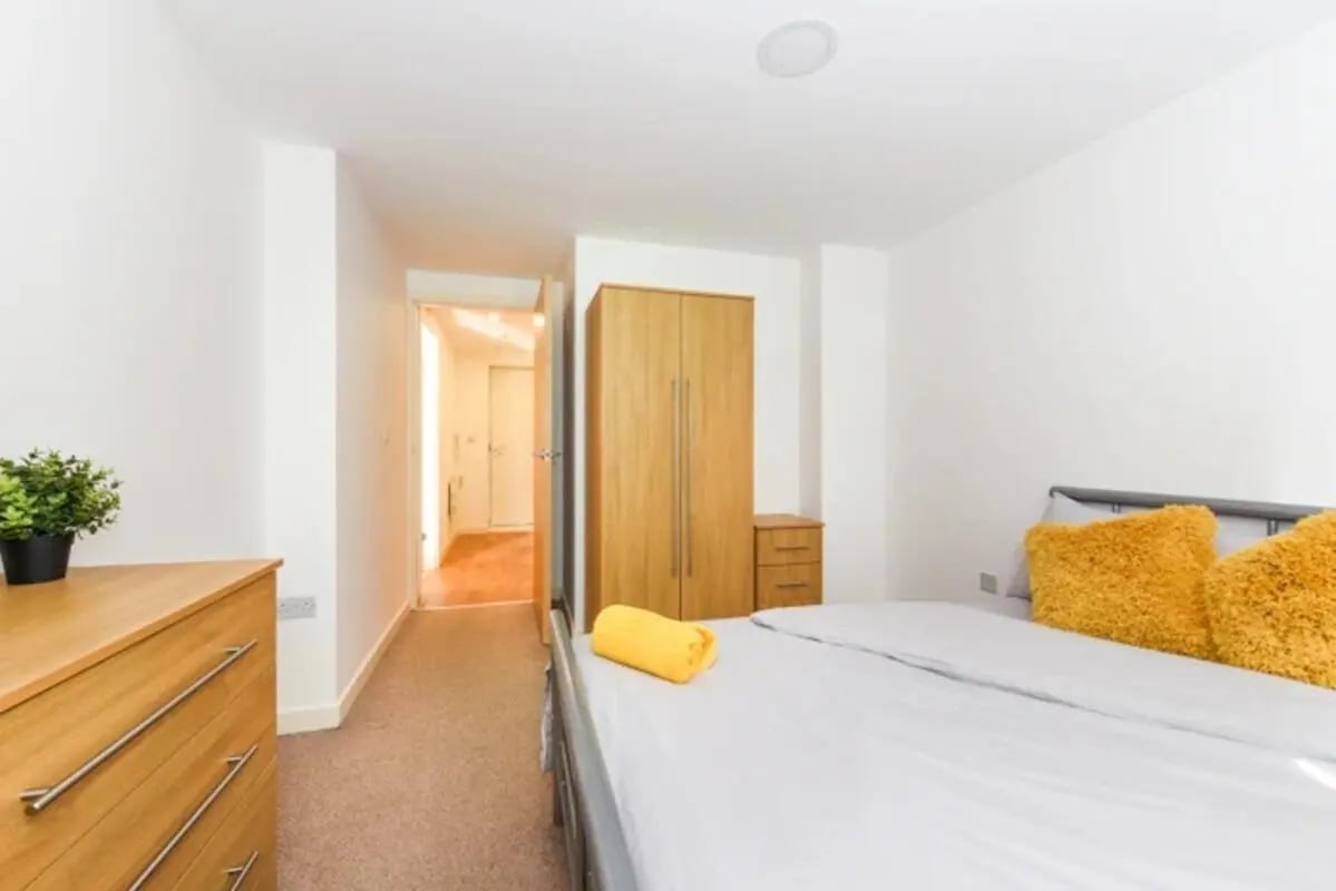Wardrobe plant chest bed with pillows bedroom at Mellor House - Central Place in Sheffield Student Accommodation