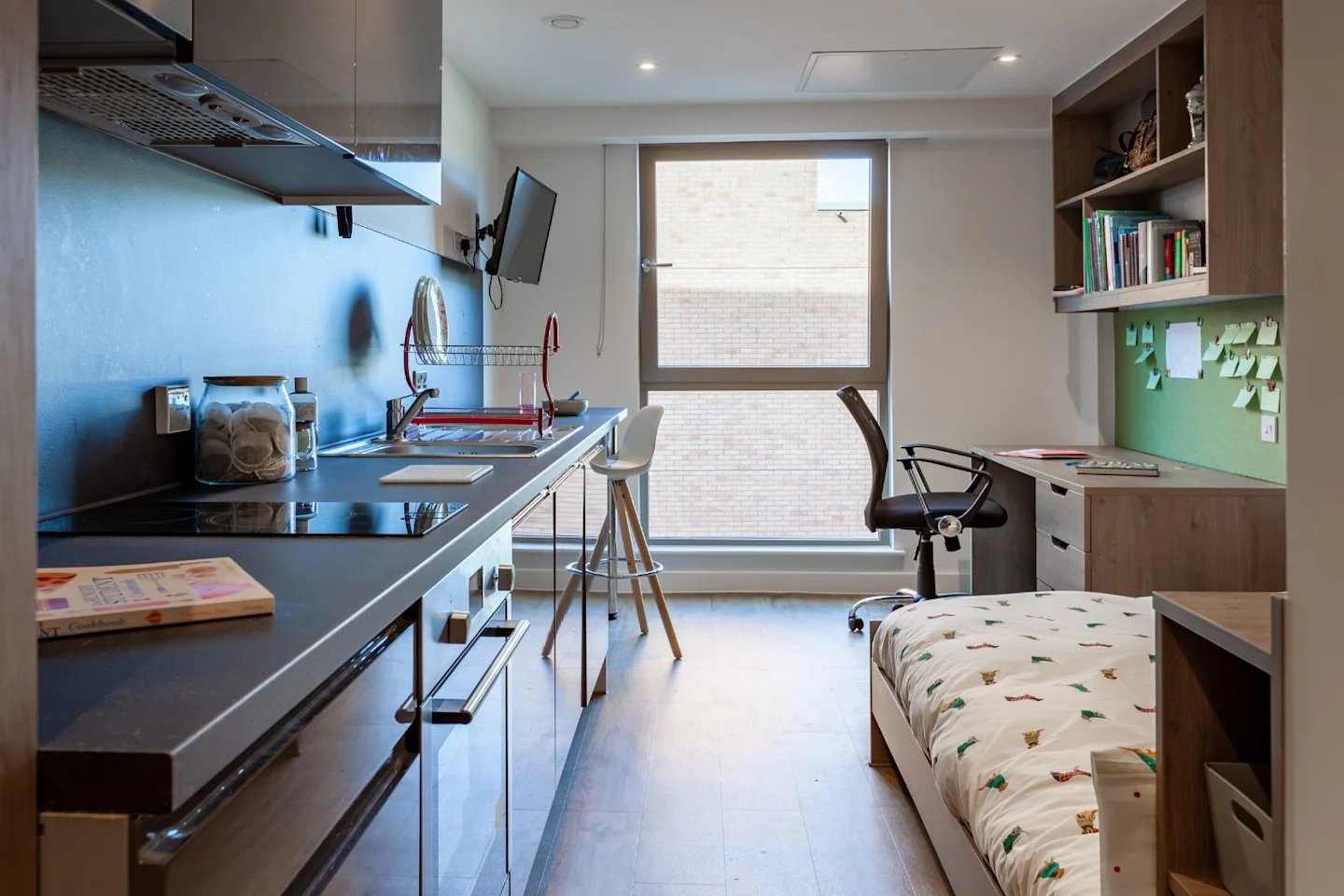 Kitchen counter bed desk and chair bedroom at Pavilion Point in Brighton Student Accommodation