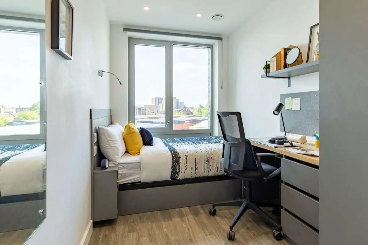 Bed desk chair with drawers study area at Great Court in London Student Accommodation