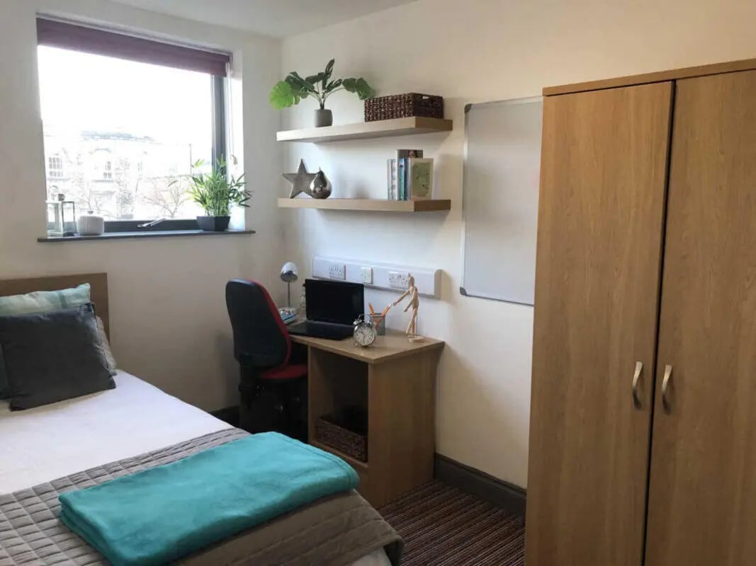 Bed desk wardrobe with shelving and plants bedroom at Norflok Street in Sunderland Student Accommodation