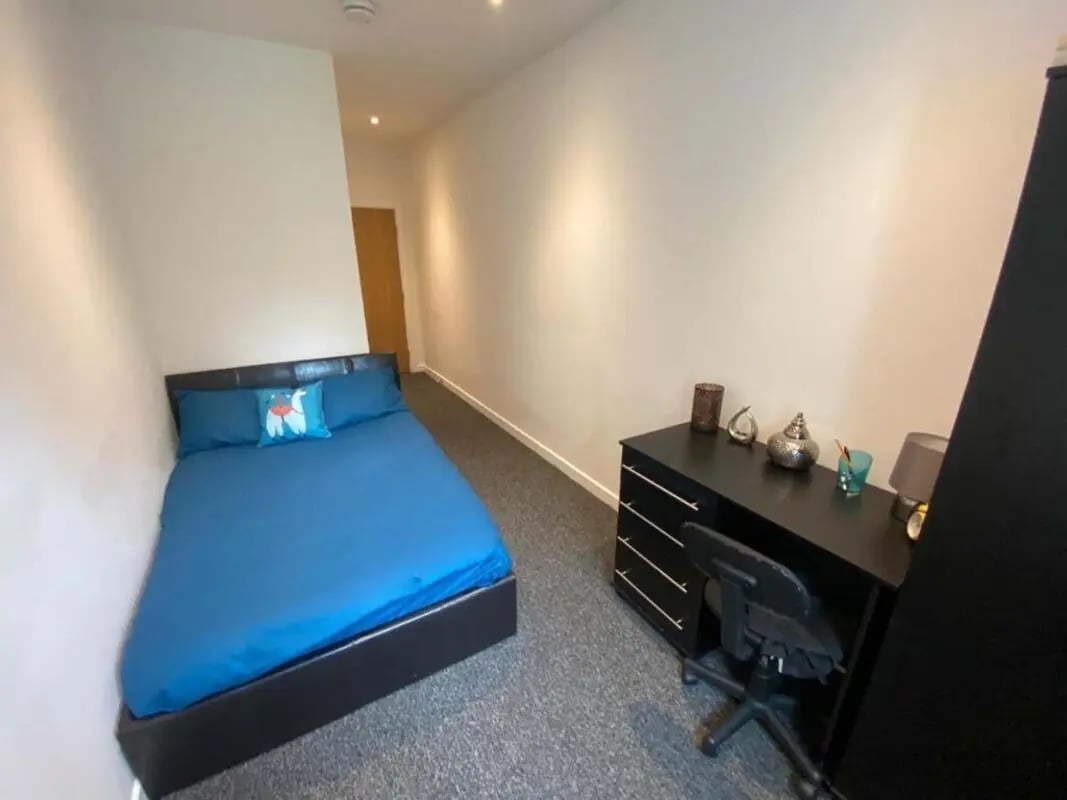 Bed desk chair and decorative items bedroom at St Mary's House Sheffield in Sheffield Student Accommodation