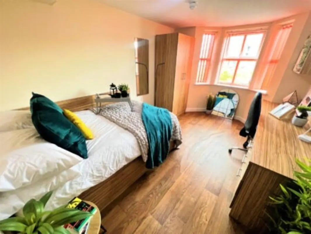 Bed desk mirror closet and window Bedroom at Waterside Court in Chester Student Accommodation