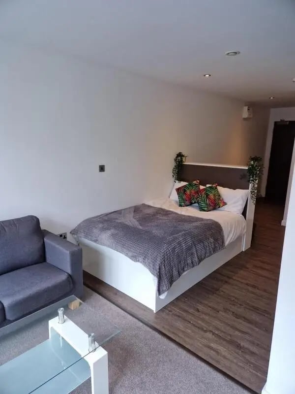 Bed sofa and coffee table studio apartment at Printworks in Sheffield Student Accommodation