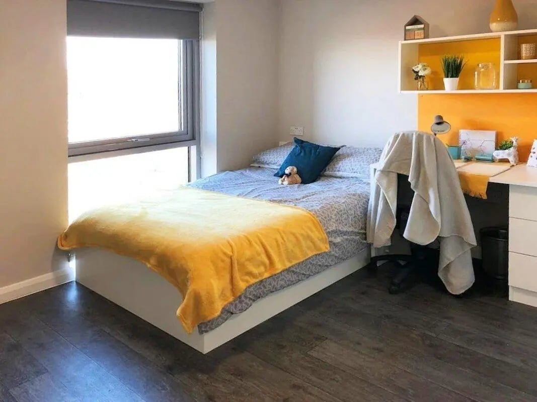 Bed desk and shelving student bedroom at One Islington Plaza in Liverpool Student Accommodation