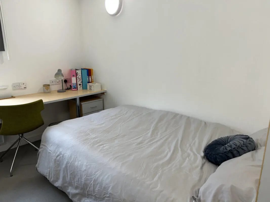 Bed desk chair files lamp bedside table bedroom at Horton House Bradford in Bradford Student Accommodation