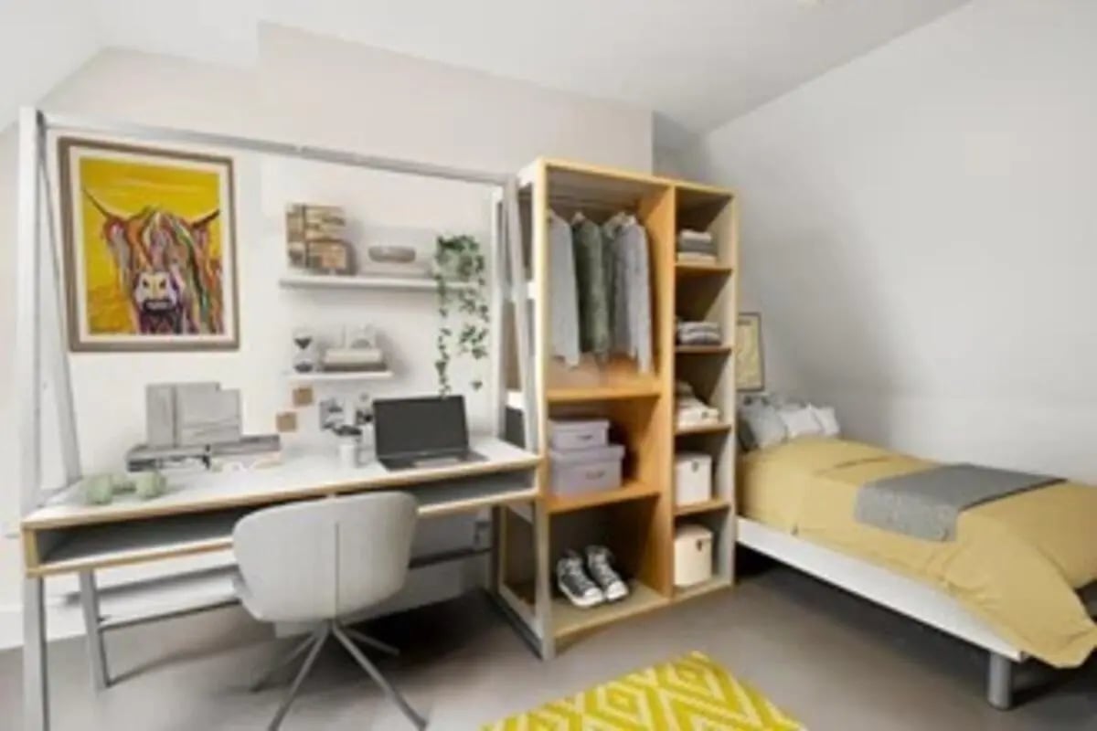 Desk chair laptop shelves clothes bed bedroom at The Old Fire Station - Birmingham in Birmingham Student Accommodation