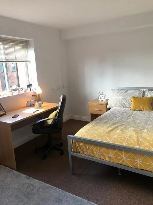 Desk bed office chair bedside table bedroom at Solly House - Central Place in Sheffield Student Accommodation