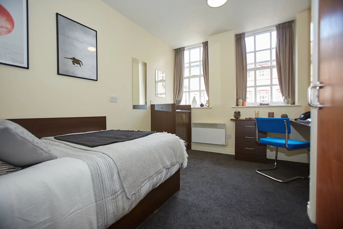 Bed desk chair mirror and heater Bedroom at Truro Sheffield in Sheffield Student Accommodation