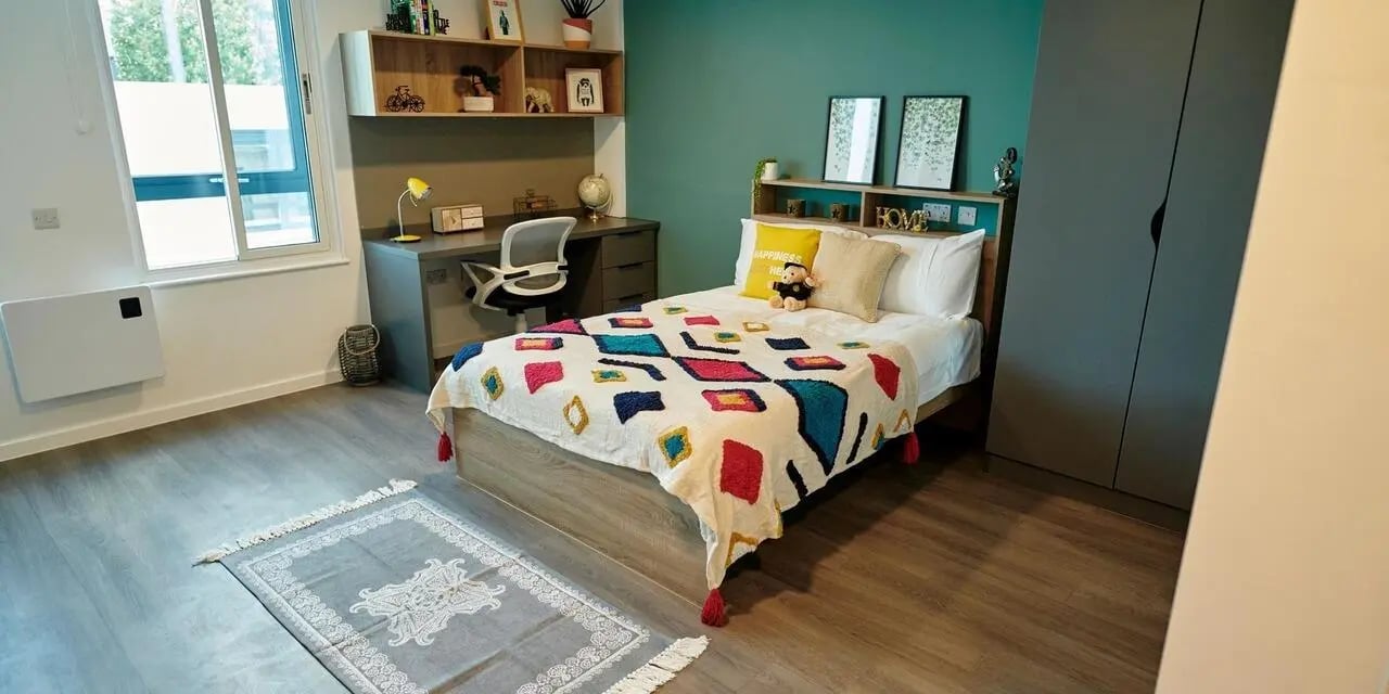 Bed desk wardrobe and rug student bedroom at Canvas Bristol in Bristol Student Accommodation