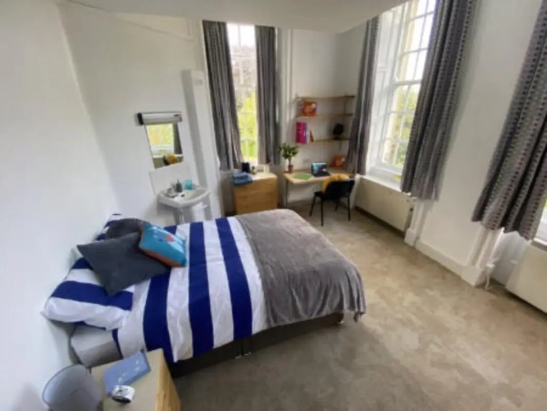Bed desk mirror sink student bedroom at St Mary's Newcastle in Newcastle Upon Tyne Student Accommodation