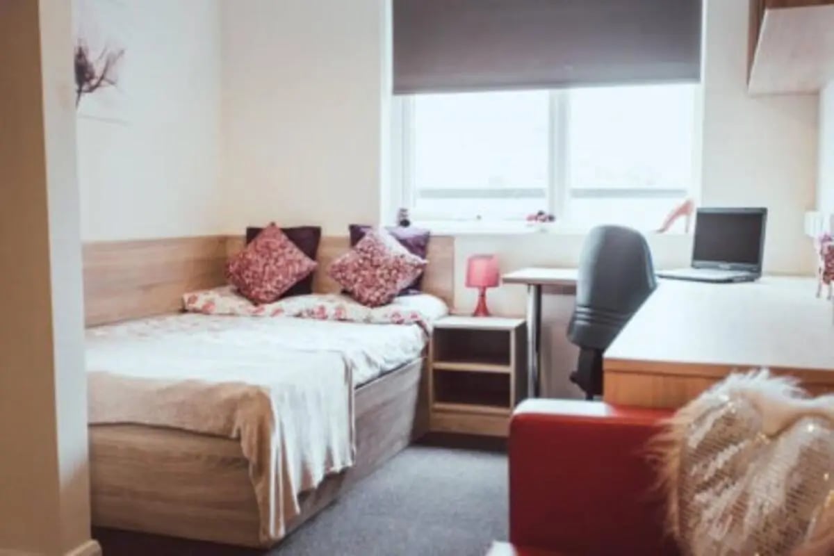 Bed desk laptop chair window bedroom at Jubilee Court in Preston Student Accommodation