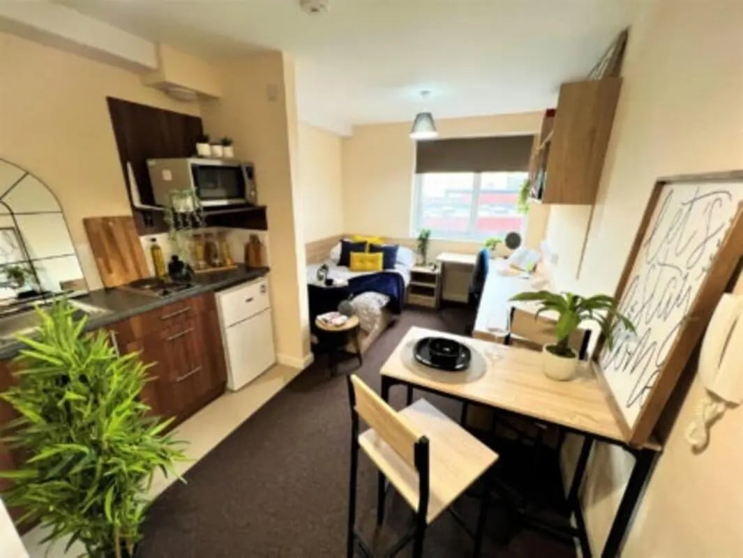 Studio apartment with kitchen bed desk and table living room at Jubilee Court in Preston Student Accommodation