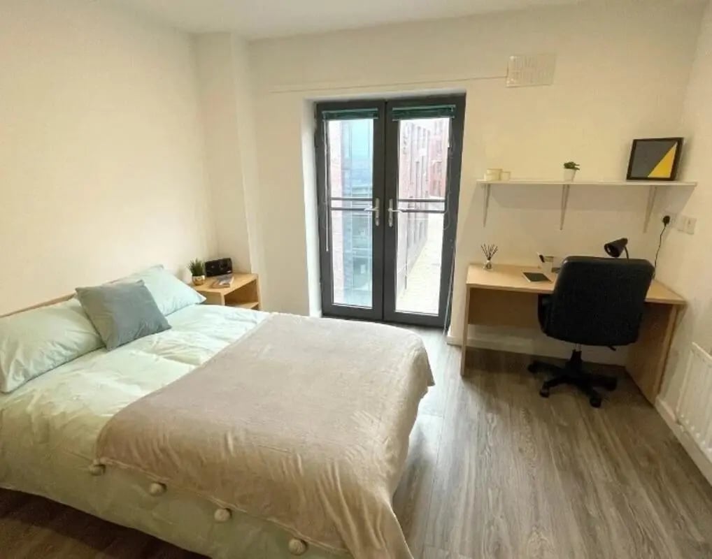 Bed desk chair and bedside table student bedroom at Page Apartments @ Central Place in Sheffield Student Accommodation
