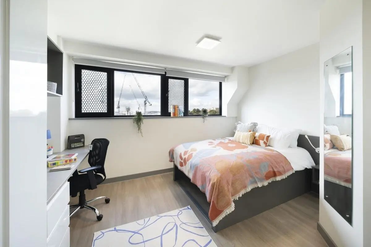 Bed desk chair and mirror bedroom at Canvas Capital House in Southampton Student Accommodation