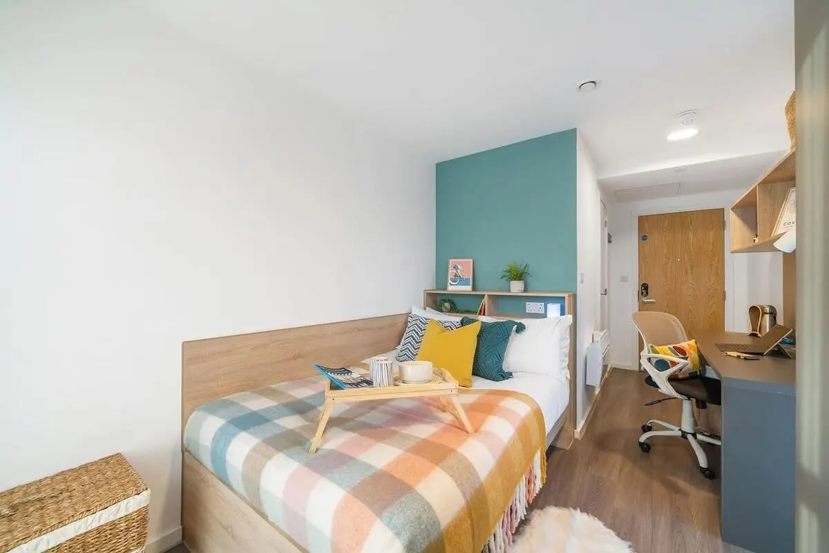 Bed desk bookshelf and chair bedroom at Canvas Coventry Arundel House in Coventry Student Accommodation