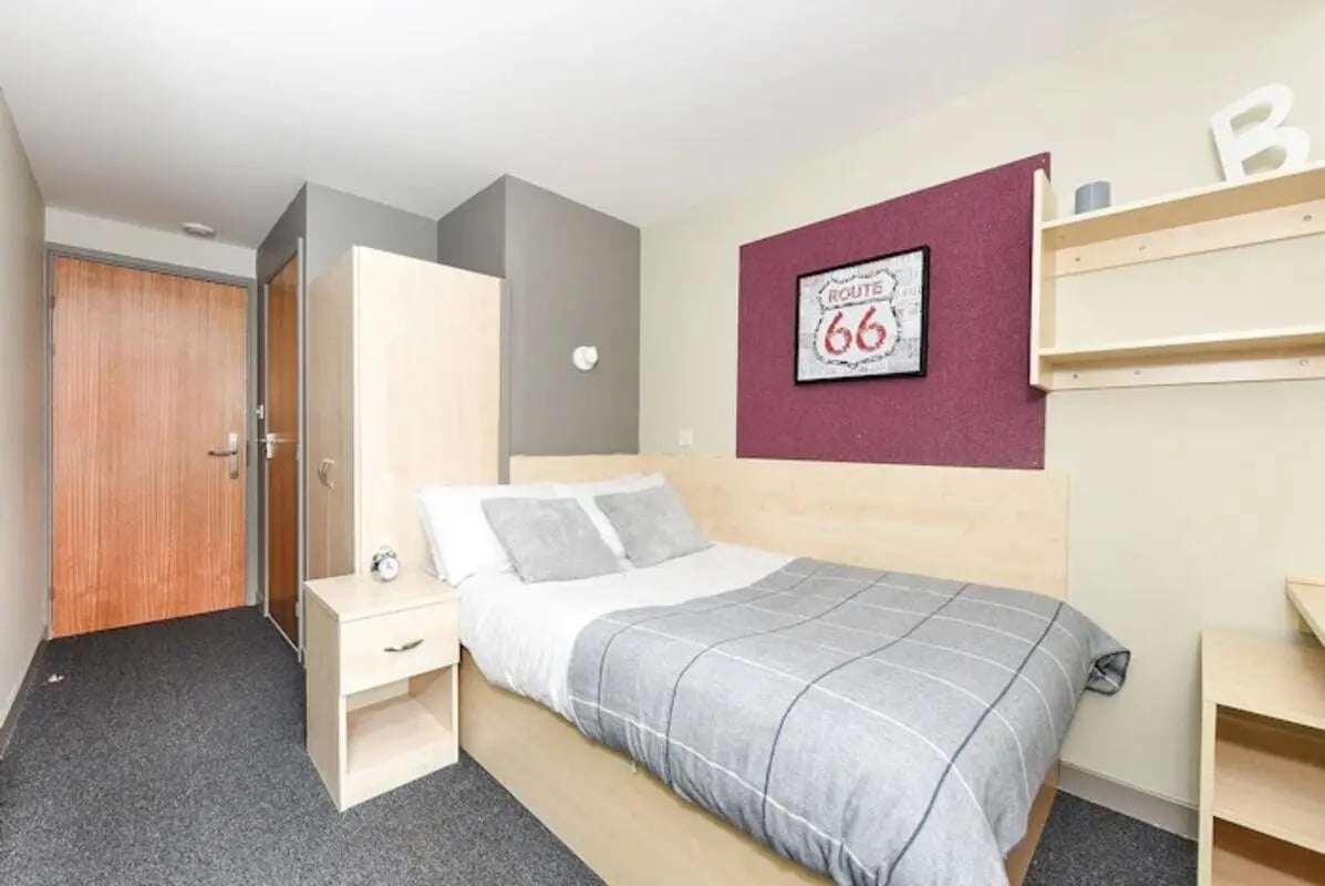 Bed wardrobe bedside table and door Bedroom at Mealmarket Exchange in Aberdeen Student Accommodation