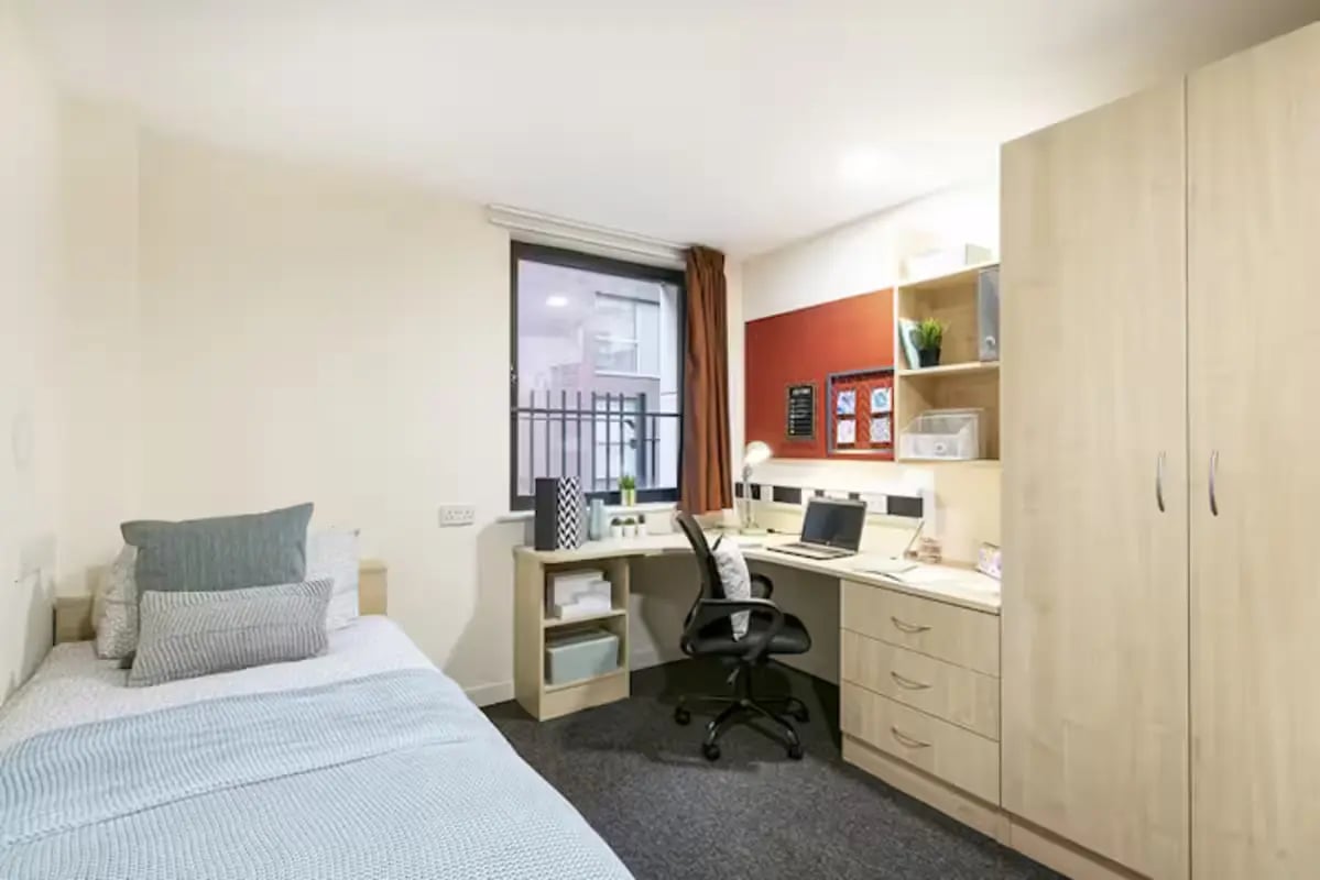 Bed desk wardrobe laptop and chair bedroom at Sheffield 3 in Sheffield Student Accommodation
