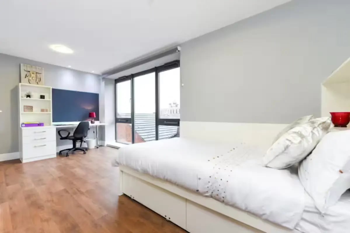 Bed with desk and shelves Bedroom at Tramways in Chester Student Accommodation