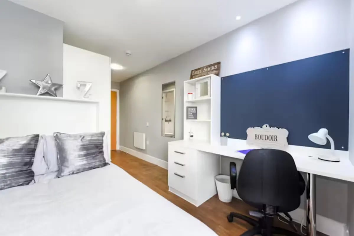 Bed desk chair and pillows bedroom at Tramways in Chester Student Accommodation