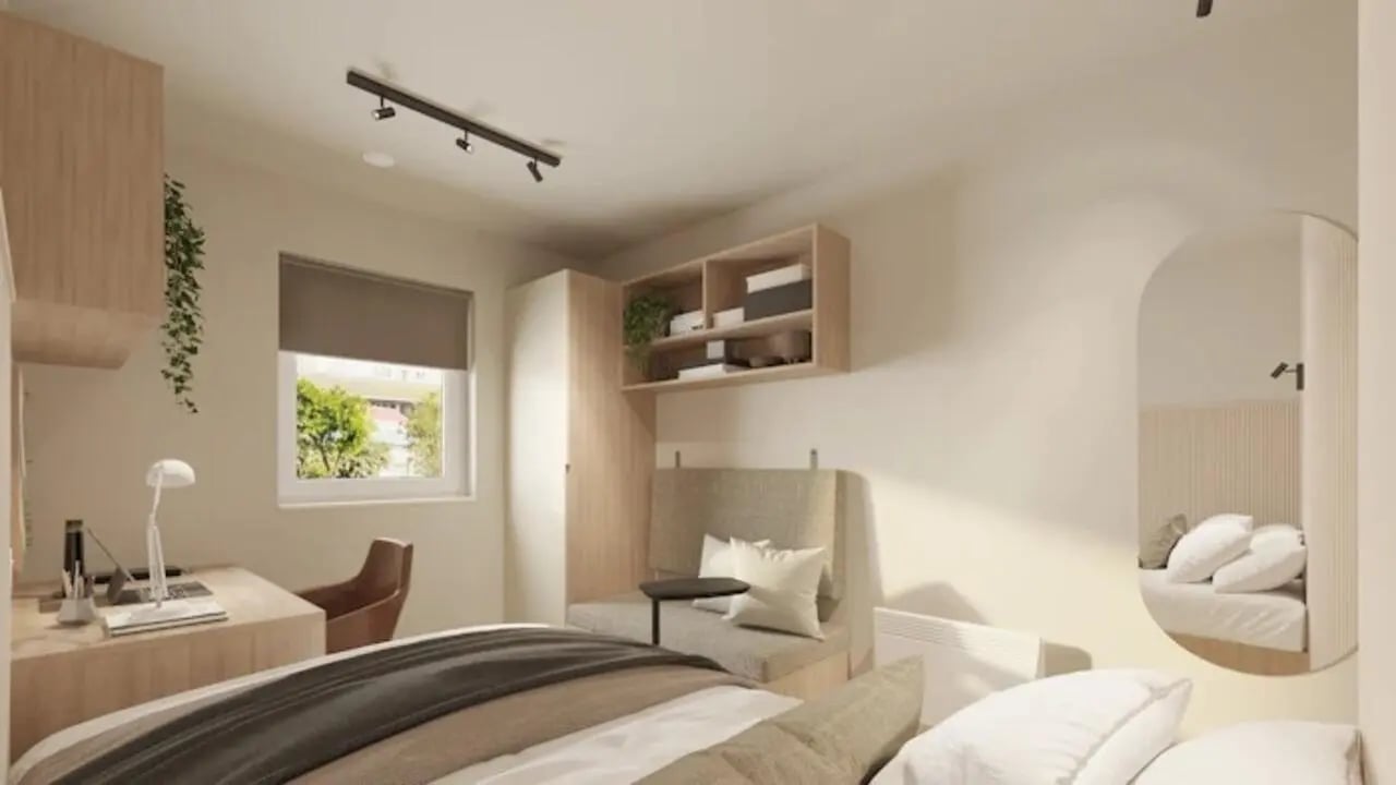 Desk chair shelves window bed seating area bedroom at Gibson Street in Glasgow Student Accommodation