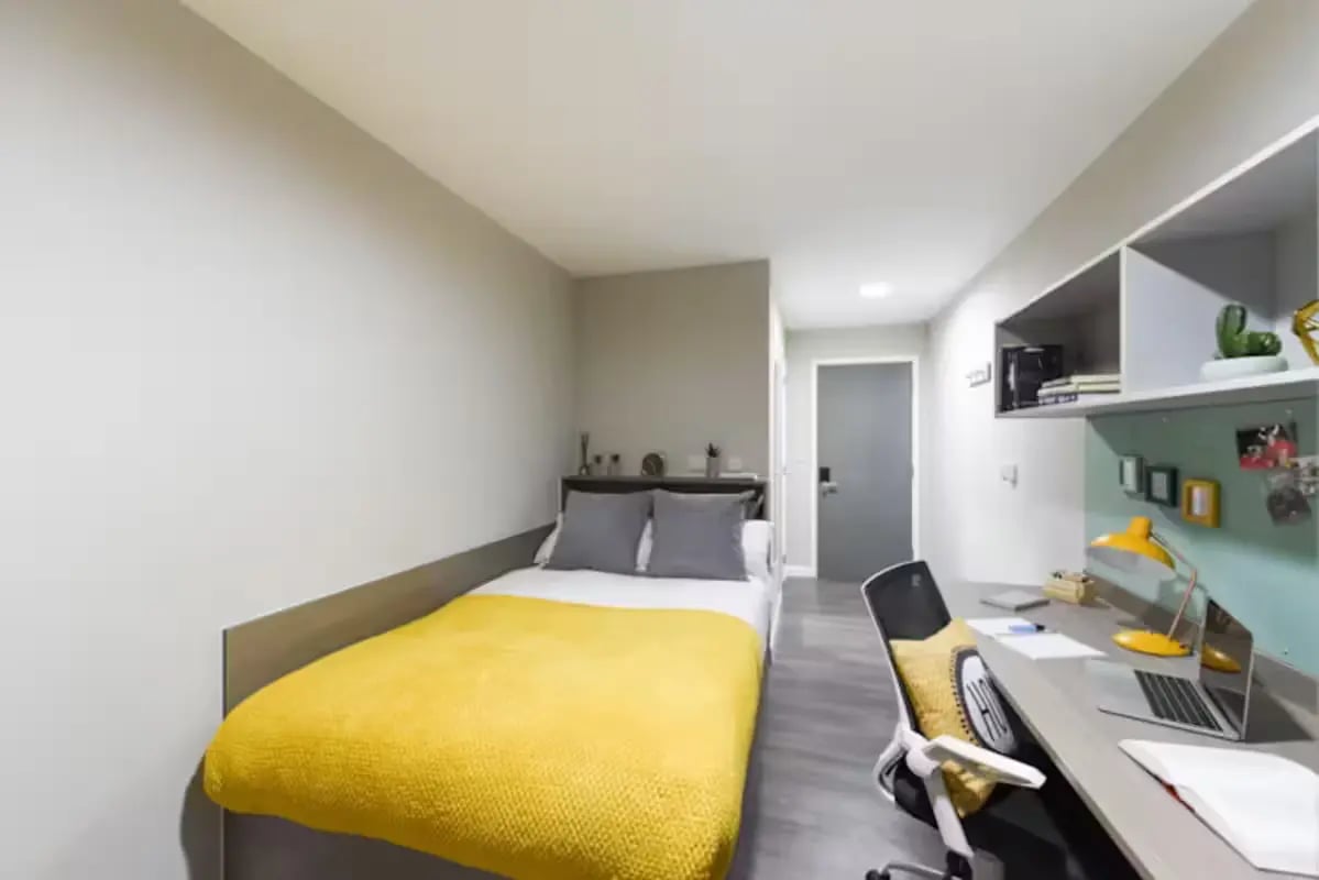 Bed desk chair and shelving unit bedroom at St Davids in Swansea Student Accommodation