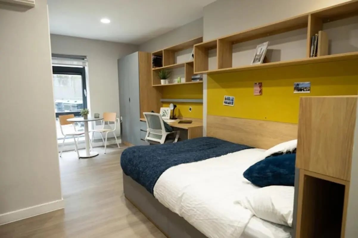 Bed desk chairs table shelves bedroom at Panmure Court in Edinburgh Student Accommodation