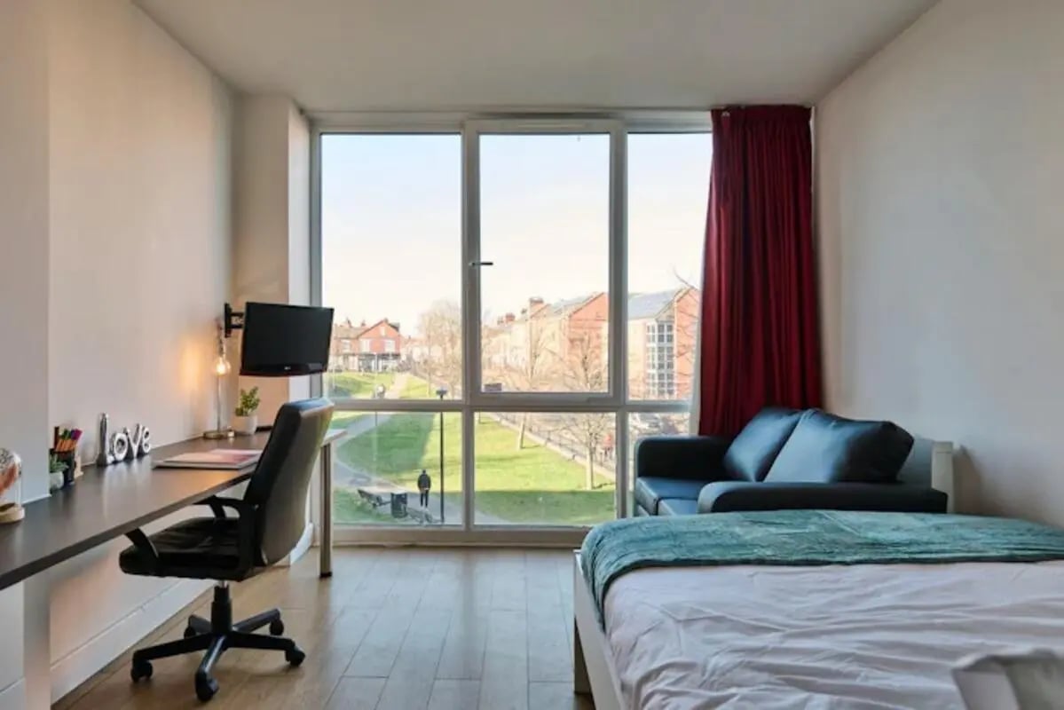 Bed desk chair sofa window view bedroom at Upperton Road in Leicester Student Accommodation