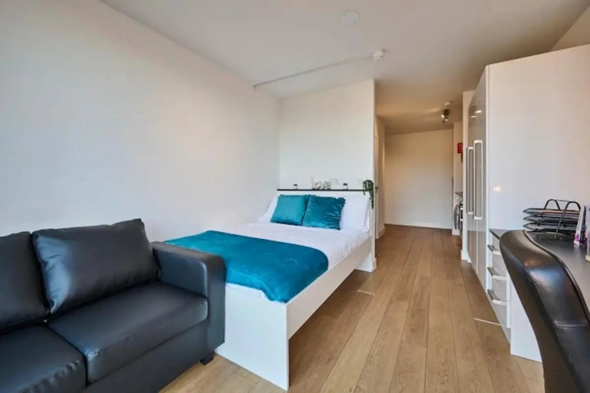 Bed couch wardrobe and desk bedroom at Upperton Road in Leicester Student Accommodation
