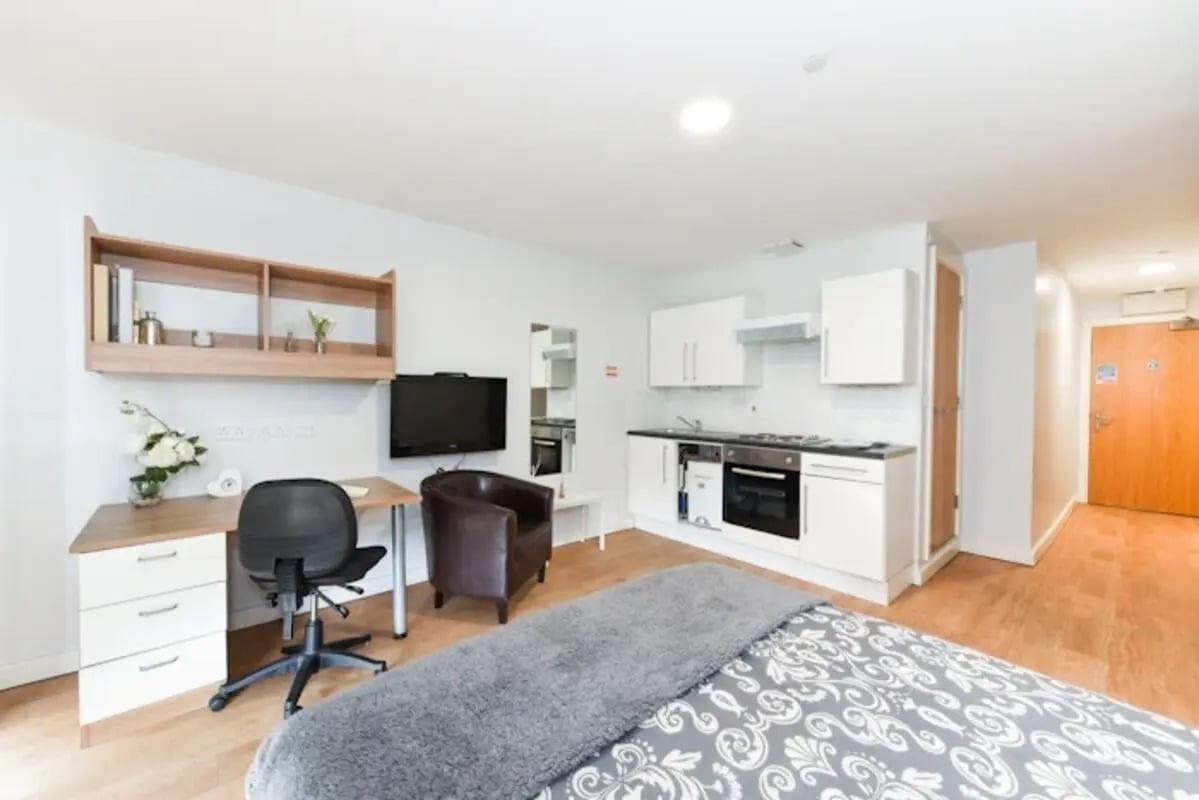 Desk chair television kitchen and bed studio at The Summit Leicester in Leicester Student Accommodation