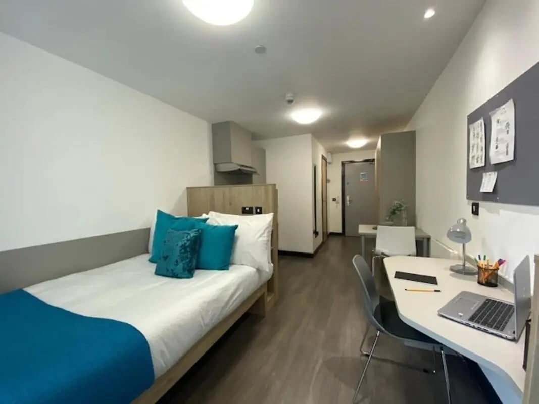 Bed desk and kitchenette student accommodation room at Swanston House in Belfast Student Accommodation
