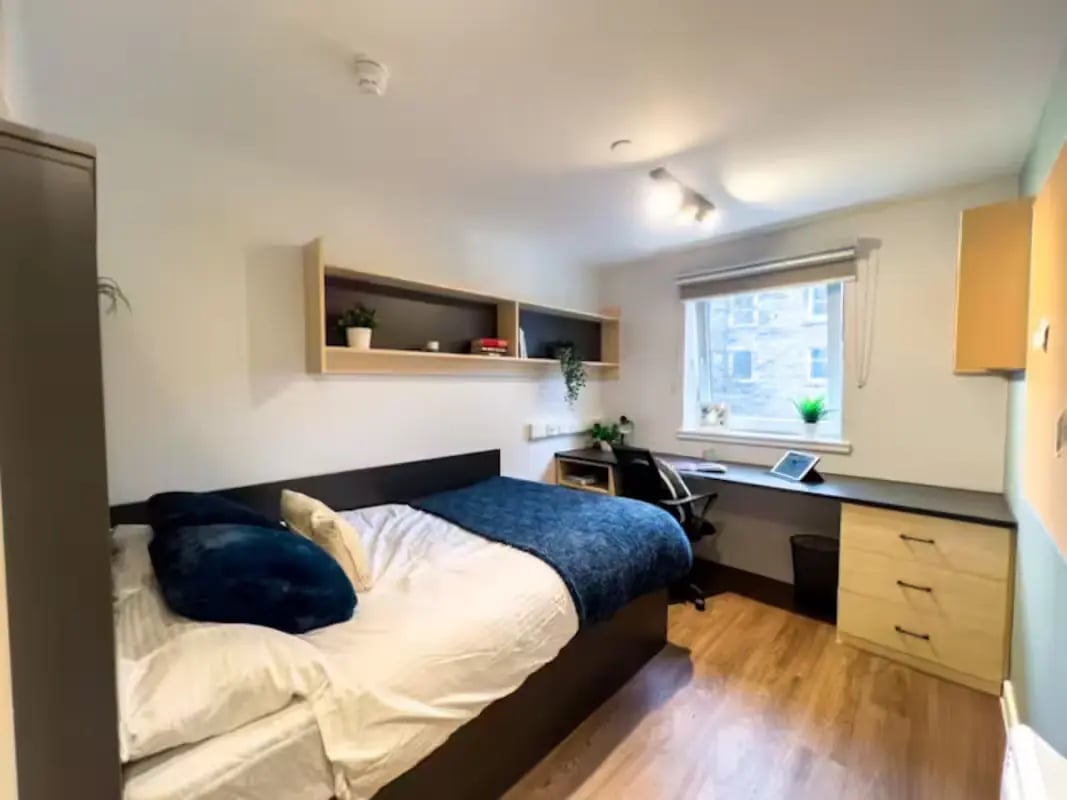 Bed desk shelves and window bedroom at Portsburgh Court in Edinburgh Student Accommodation