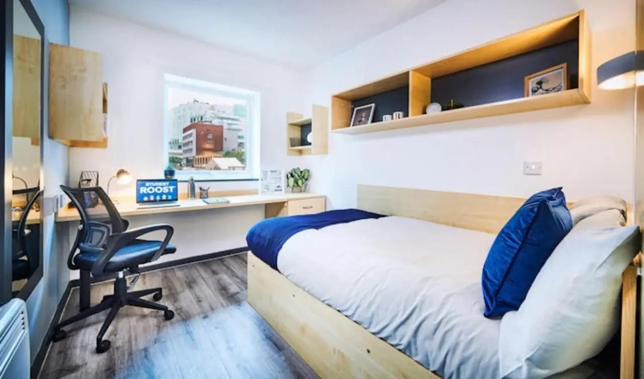 Bed desk chair shelves in bedroom at Capital Gate in Liverpool Student Accommodation