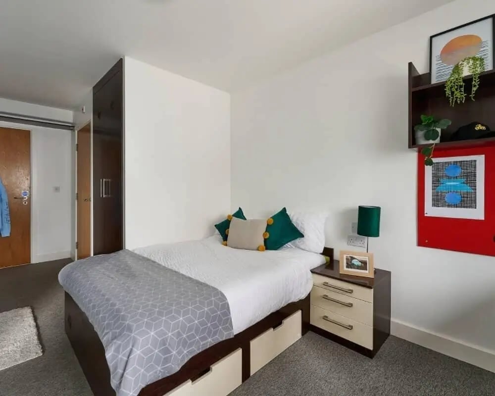 Bed with storage drawers beside nightstand bedroom at Heantun Point in Wolverhampton Student Accommodation