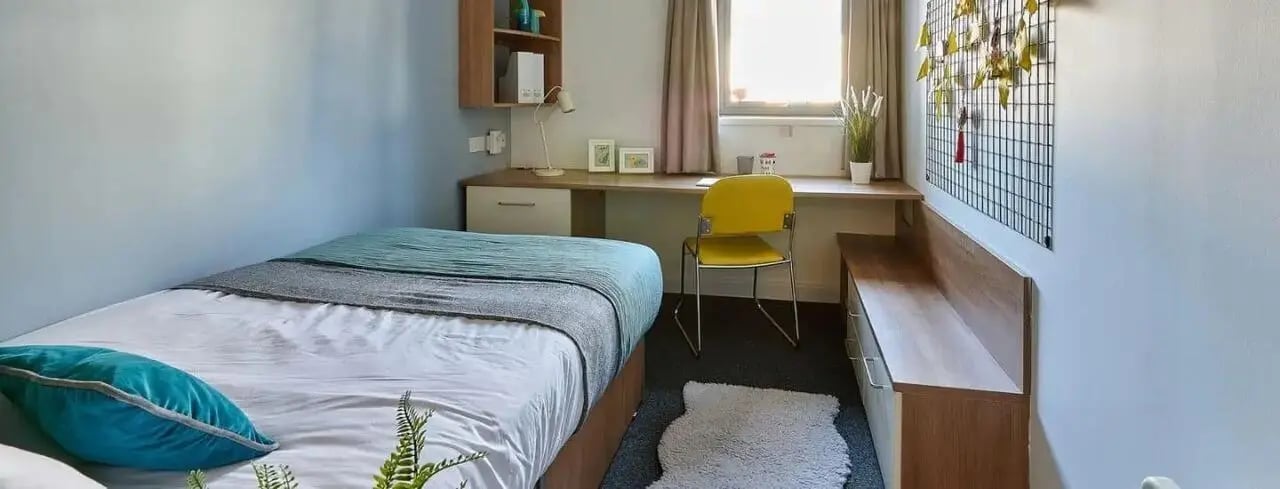 Bed desk chair shelving unit and storage bedroom at Exeter Trust House in Exeter Student Accommodation