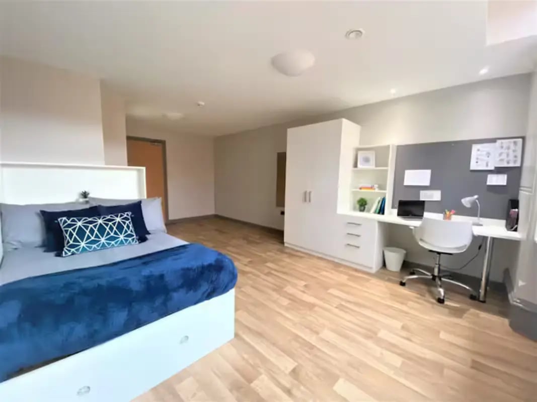 Bed study area wardrobe and desk bedroom at John Bell House in Belfast Student Accommodation